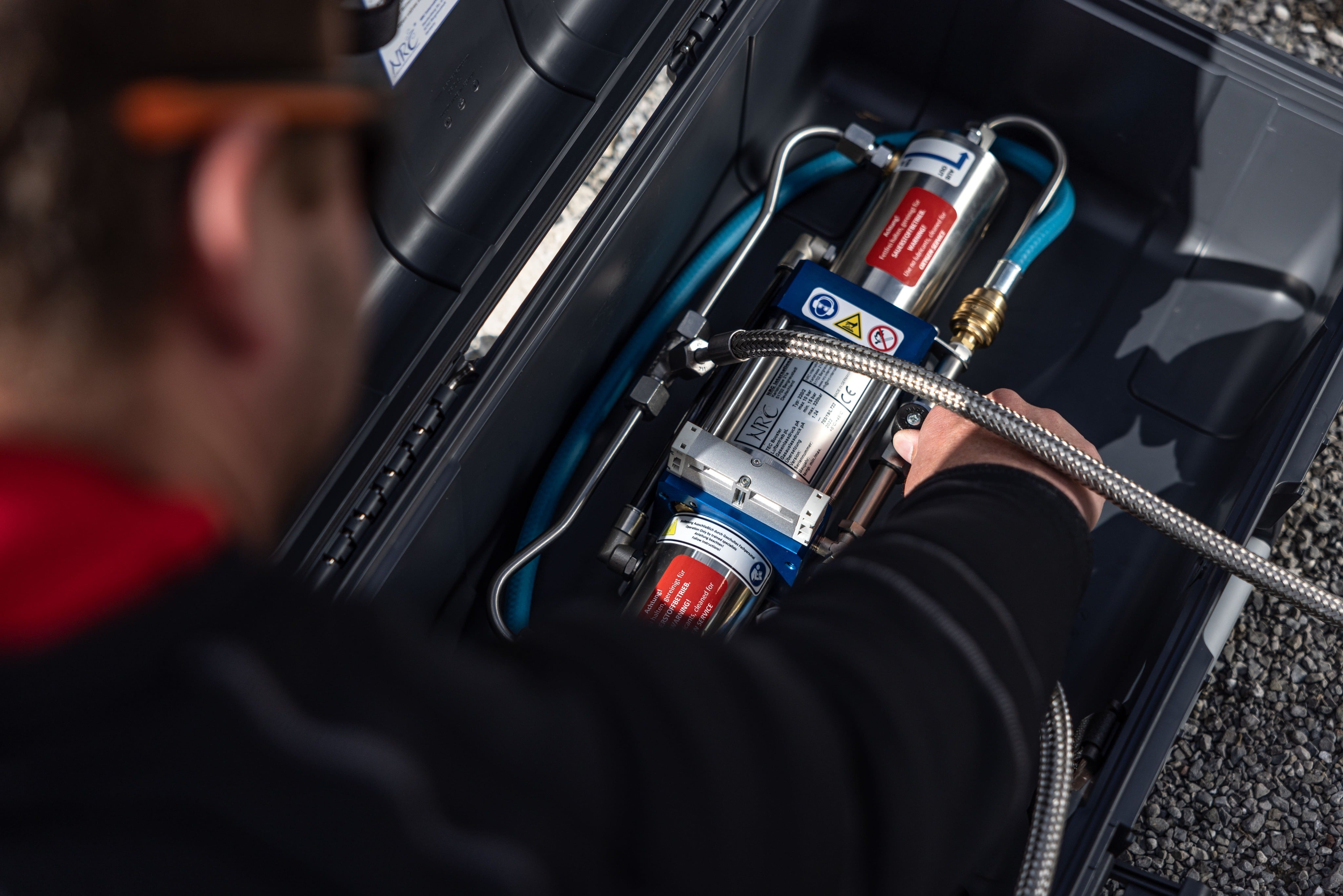 a man trying to check the gas booster for diving