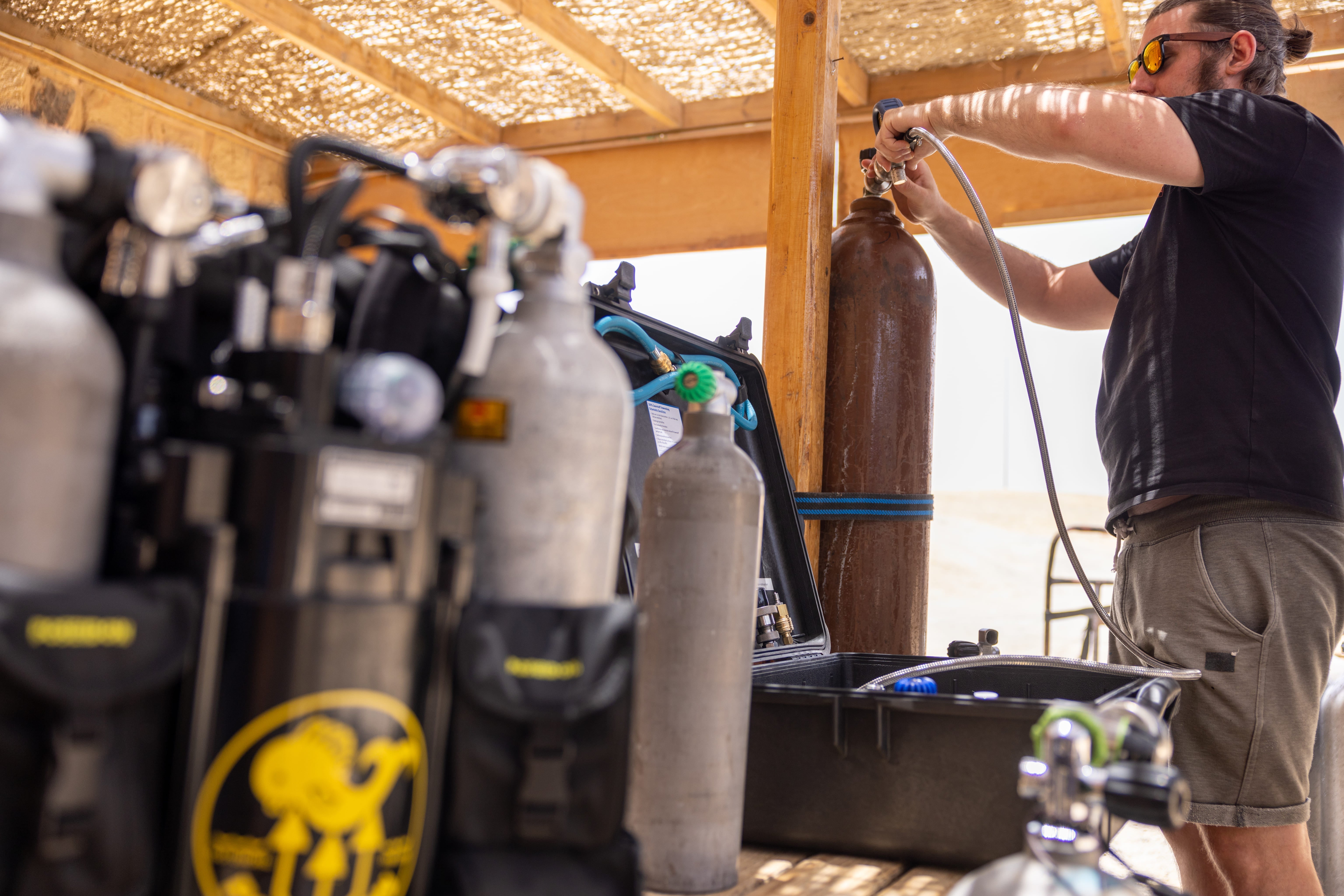 a man filling gas diving 