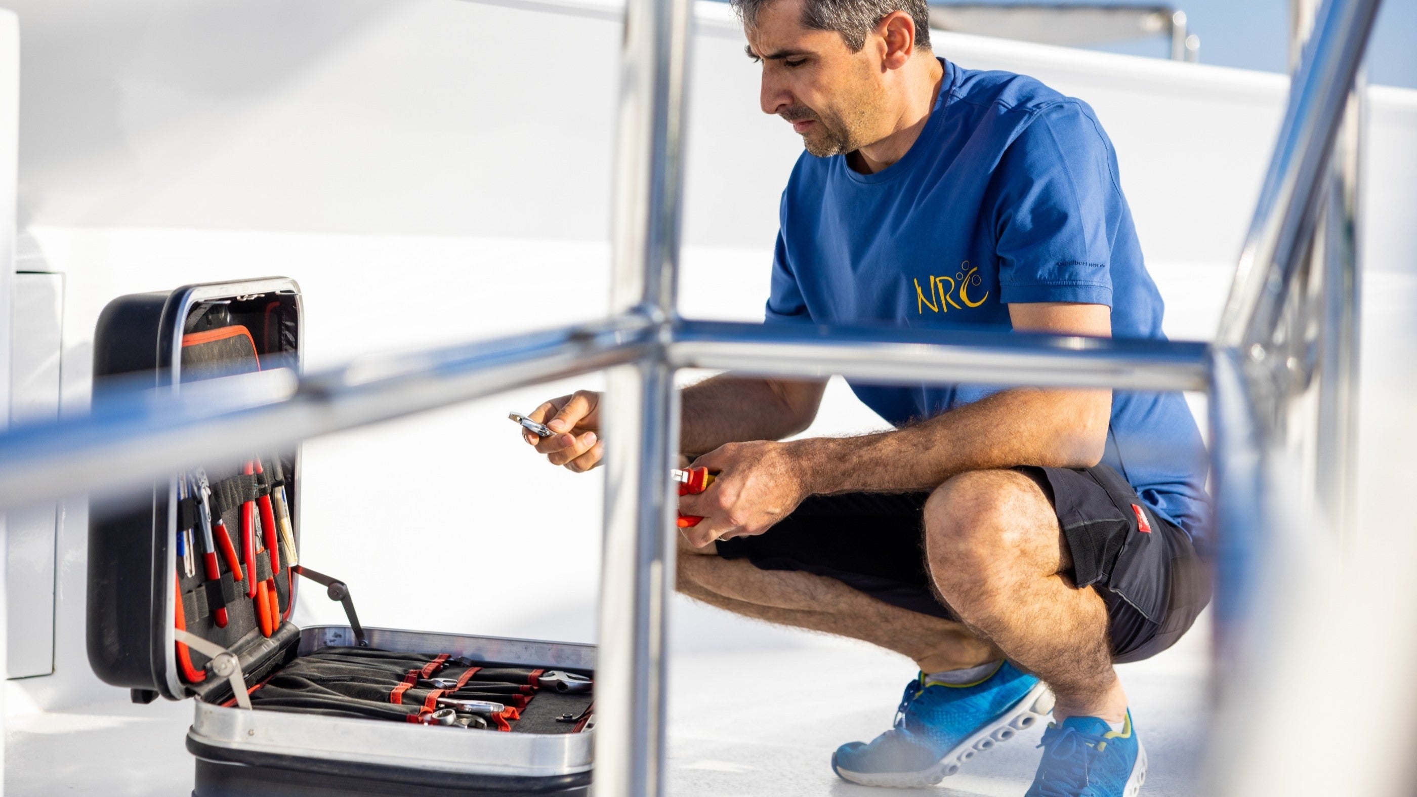 man preparing tools to do boat or liveaboard maintenance tasks