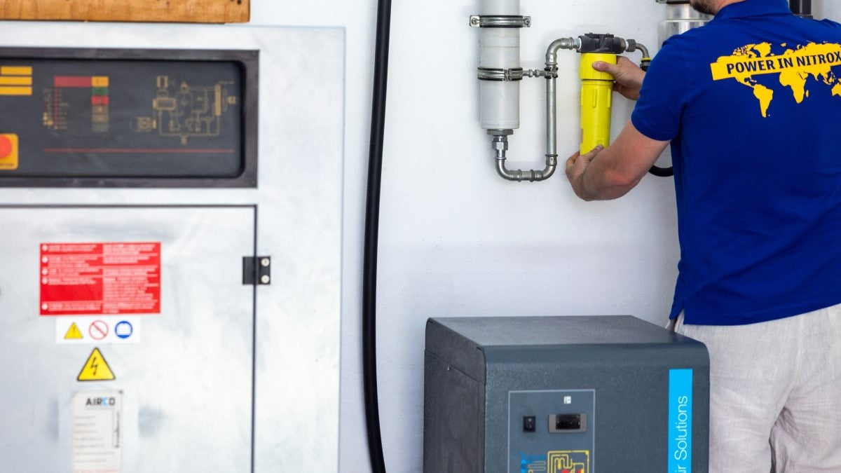 man in liveaboard using nitrox membrane system by NRC International