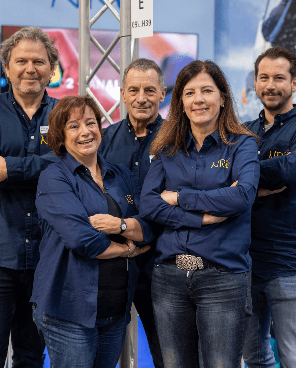 NRC International support team standing together, representing the company’s worldwide customer assistance and technical expertise.